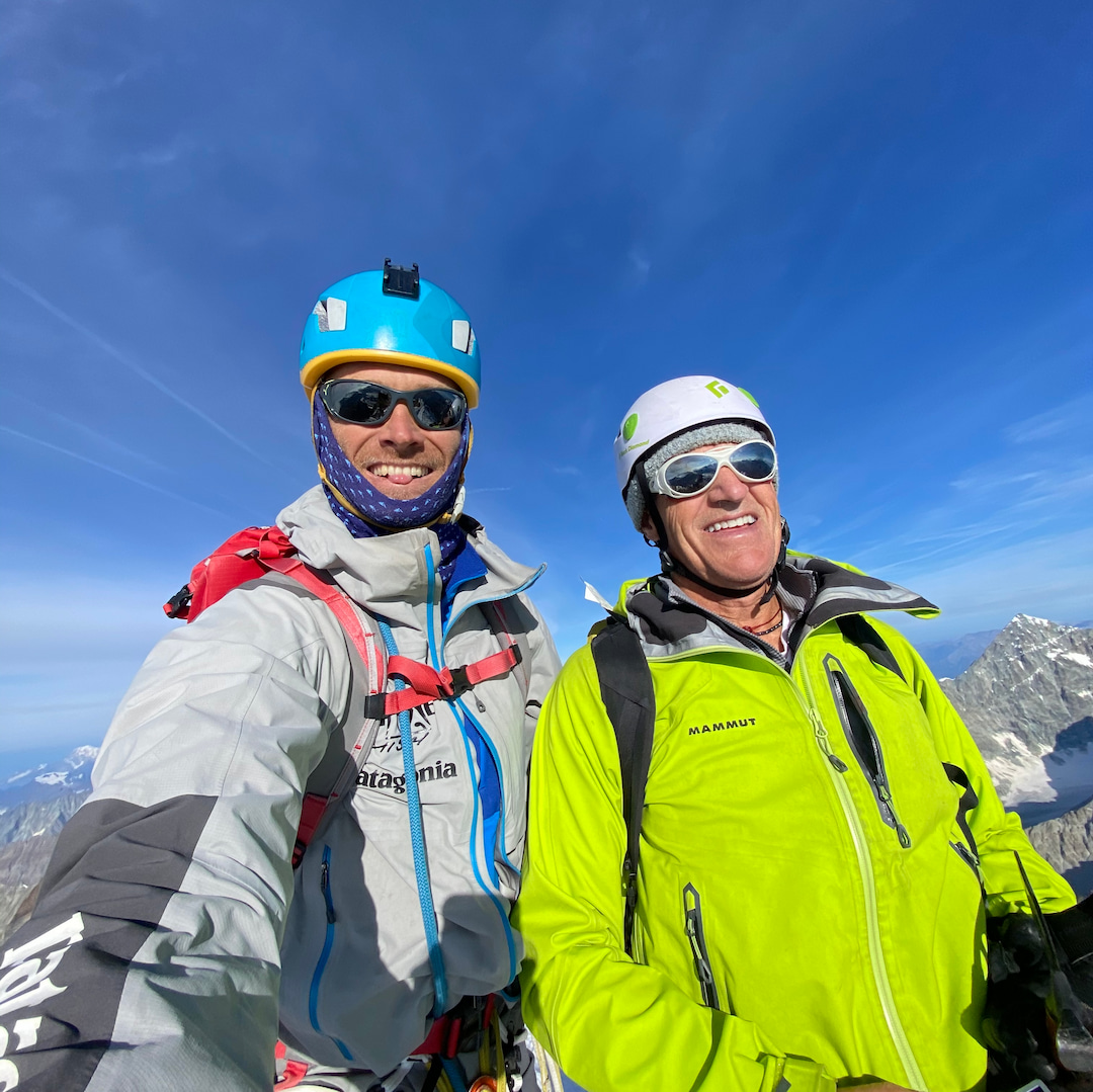 Two guides on a summit